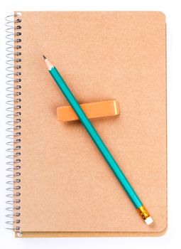 Notebook with pencil and an eraser on white background
