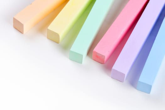 set of colored crayons on a white background