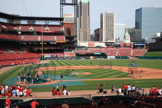 Fans gather for batting practice at a St. Louis Cardinals baseball game at Busch Stadium.