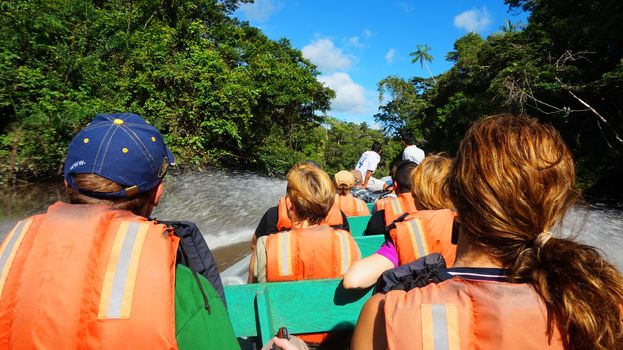 Cuyabeno, Sucumbios / Ecuador - November 20 2014: Tourists traveling by boat on a river in the Ecuadorian Amazon