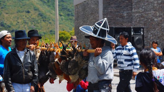 Cuicocha, Imbabura / Ecuador - June 22 2014: Indigenous group celebrating the solstice party near Cuicocha lagoon