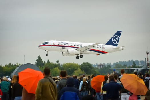 Zhukovsky, Moscow region, Russia - August 24, 2009: The Sukhoi Superjet 100 is a modern fly-by-wire twin-engine regional passenger jet at the International Aviation and Space salon MAKS-2009