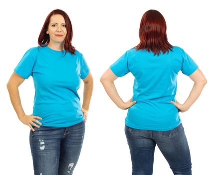 Photo of a woman posing with a blank light blue t-shirt and red hair, ready for your artwork or design.