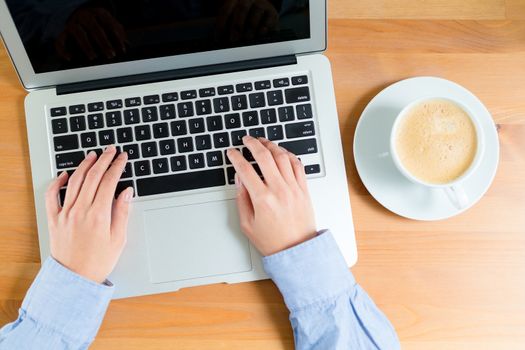 Top view of woman using laptop computer