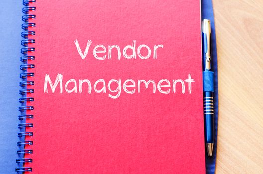 Vendor management text concept write on notebook with pen