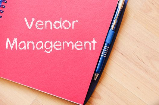 Vendor management text concept write on notebook with pen