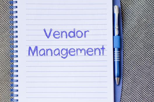 Vendor management text concept write on notebook with pen
