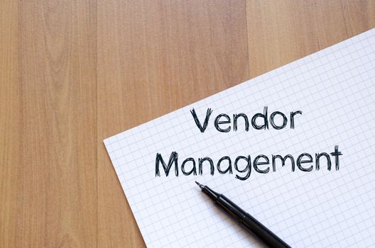 Vendor management text concept write on notebook with pen
