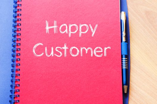 Happy customer text concept write on notebook with pen