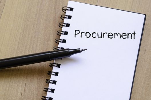 Procurement text concept write on notebook with pen