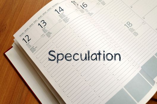Speculation text concept write on notebook with pen