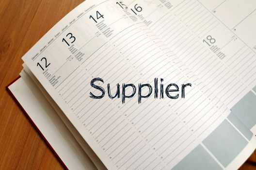 Supplier text concept write on notebook