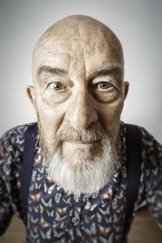 An image of an old man with a beard wide angle portrait