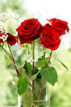 Nice red roses bouquet in glass vase