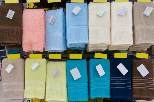Towels Hang on Shelf in Supermarket or Hypermarket as Backround with blank Tag