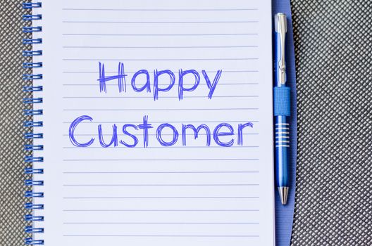 Happy customer text concept write on notebook with pen