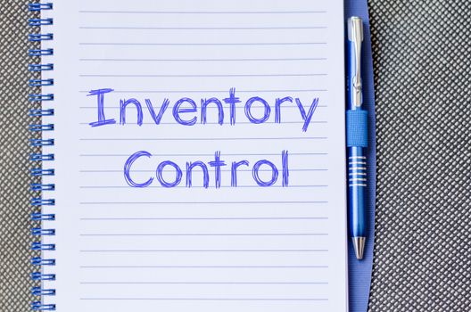 Inventory control text concept write on notebook with pen