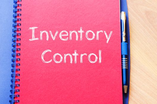 Inventory control text concept write on notebook with pen
