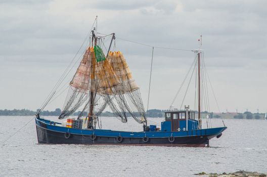 Fishing boat on the Grevelingenmeer in Holland. Shot at dusk.