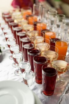 drinks in cups and glasses on the table, buffet