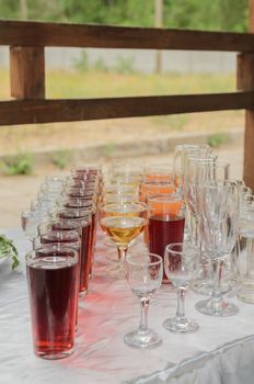 drinks in cups and glasses on the table, buffet