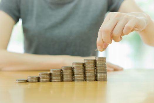 women put coin stack money for money growth concept