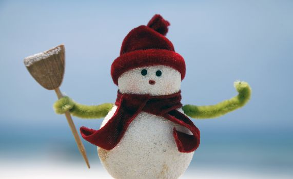 Toy of the snowman on blue background
