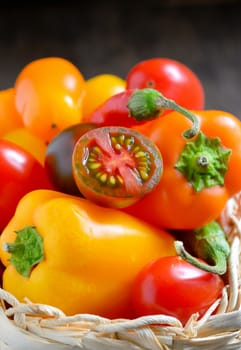 Fresh ripe colorful vegetables tomatoes in basket