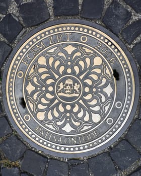 Round beautiful metal manhole cover in Budapest