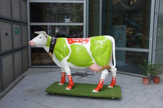 Sculpture of cow painted