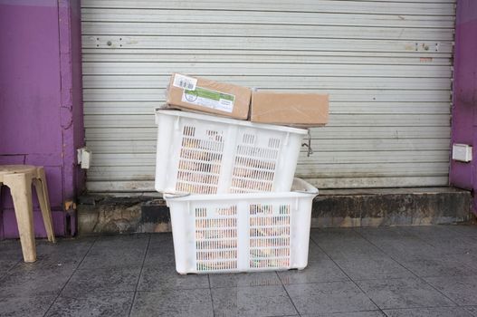 Pile of white plastic basket and paper boxPile of white plastic basket and paper box