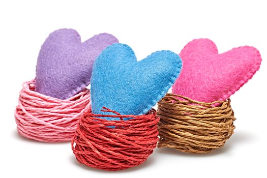 Love heart. Valentines  Day. Handmade hearts in nests. Vintage romantic style. Vivid greeting card, multicolored felt, isolated on white