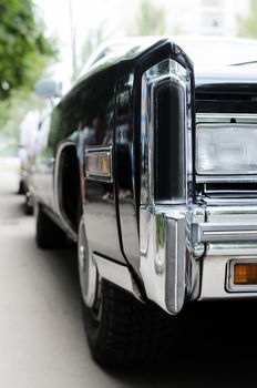 black vintage wedding car consisting of the tuple