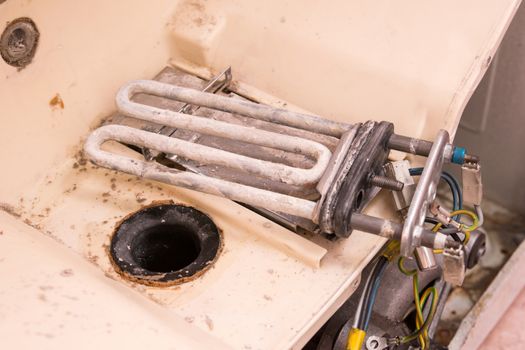 The heating element in the scale of the washing machine