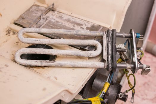 Scale on the heating element of the washing machine