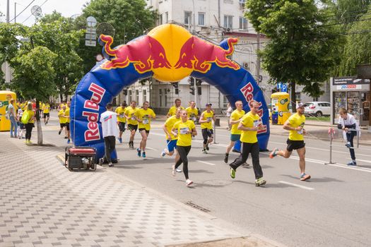Krasnodar, Russia - May 22, 2016: Participants in the race "5000 meters with a major league" red running down the street in Krasnodar