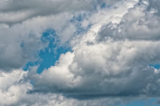 Blue sky background with a tiny clouds