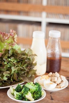 Fresh hydroponic vegetables on wooden table, stock photo