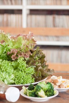 Fresh hydroponic vegetables on wooden table, stock photo