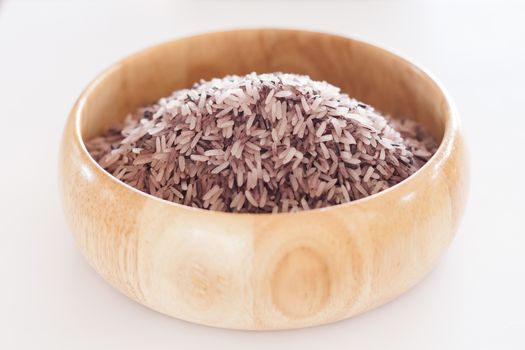 Berry rice in wooden bowl, stock photo