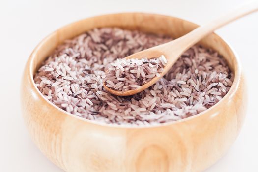 Berry rice in wooden bowl, stock photo
