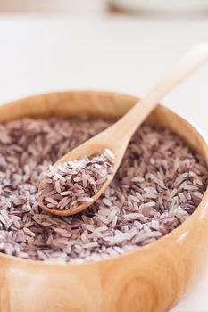Berry rice in wooden bowl, stock photo