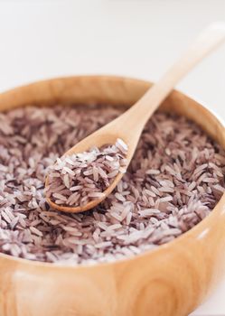 Berry rice in wooden bowl, stock photo