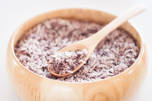 Berry rice in wooden bowl, stock photo