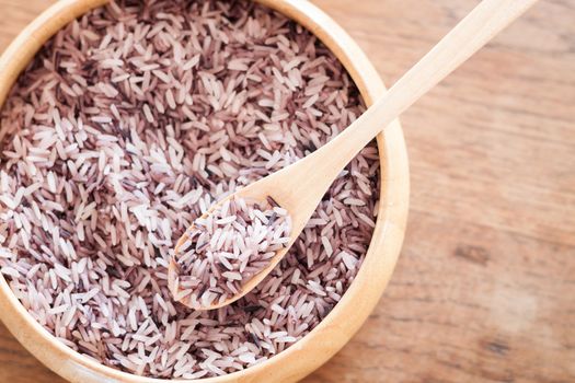 Berry rice in wooden bowl, stock photo
