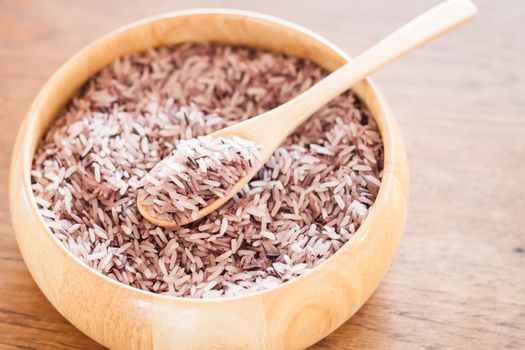 Berry rice in wooden bowl, stock photo