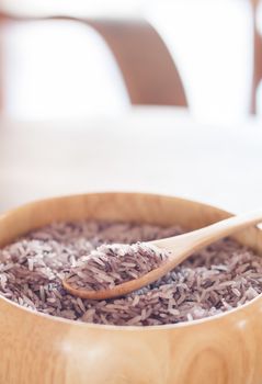 Berry rice in wooden bowl, stock photo