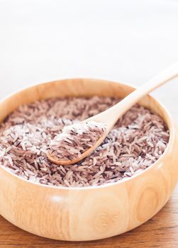 Berry rice in wooden bowl, stock photo