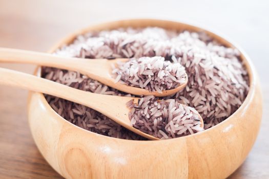 Berry rice in wooden bowl, stock photo