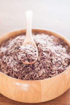 Berry rice in wooden bowl, stock photo